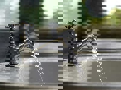 Faucet Running Water Shutterstock 153406115